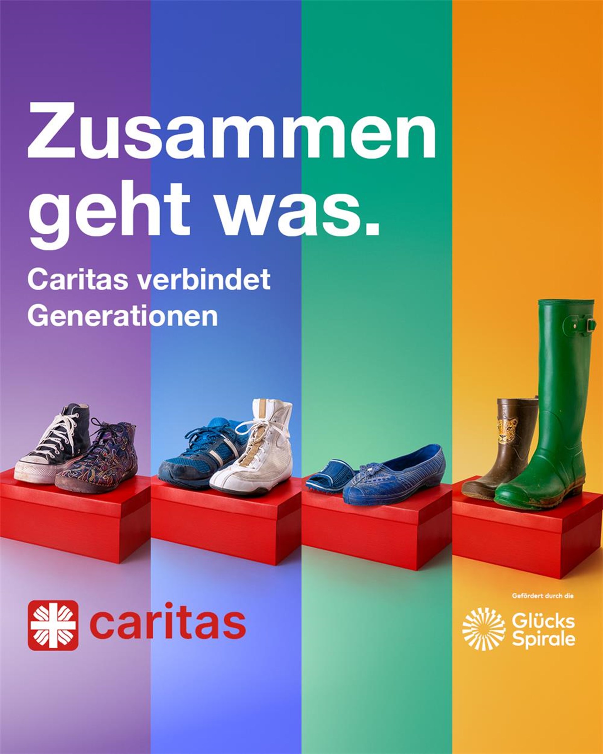 Einzelne Schuhe auf roten Schuhkartons vor Regenbogen-Hintergrund.